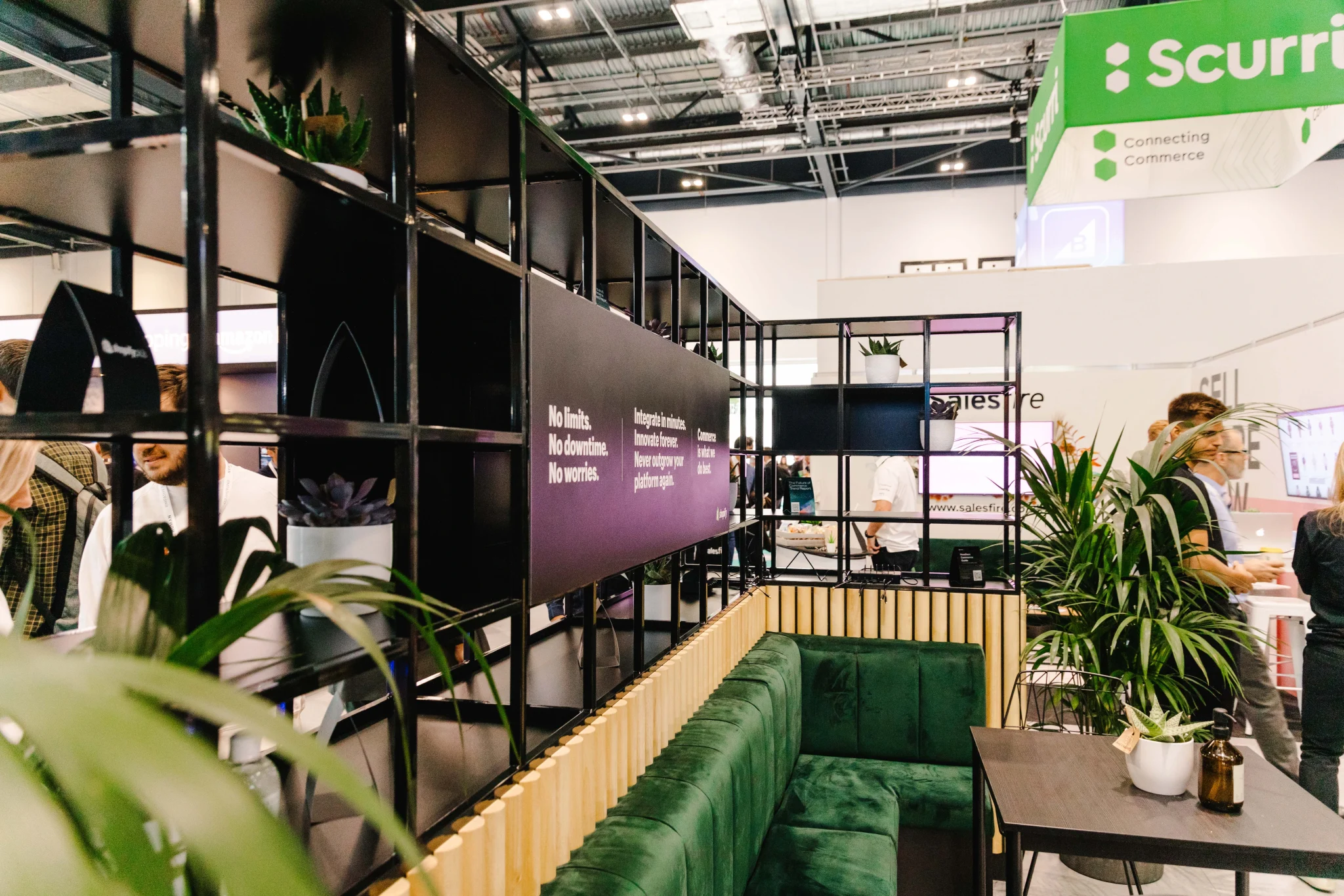 sustainable stand for shopify showing bamboo display units and green sofa