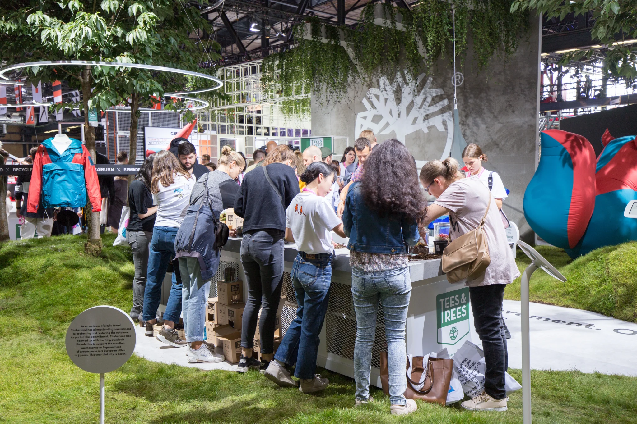 sustainable stand for timberland showing guest engaging with sustainable activities 